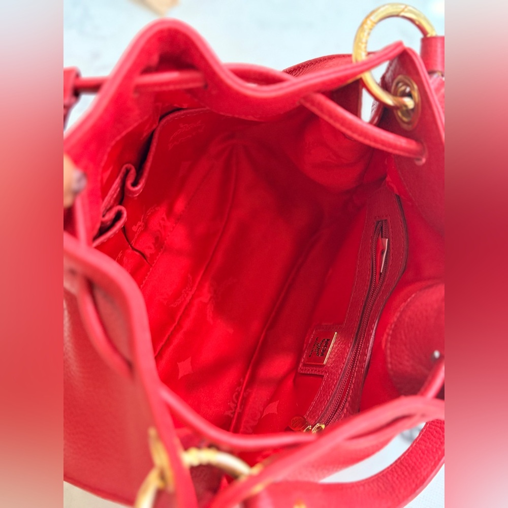 MCM Red Leather Bucket Bag
Crossbody Drawstring Gold Hardware - Picture 12 of 17
